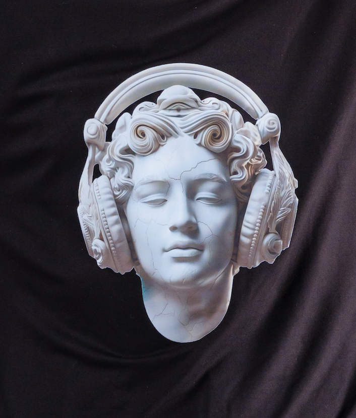 White marble bust of a classical figure wearing modern headphones on a black background