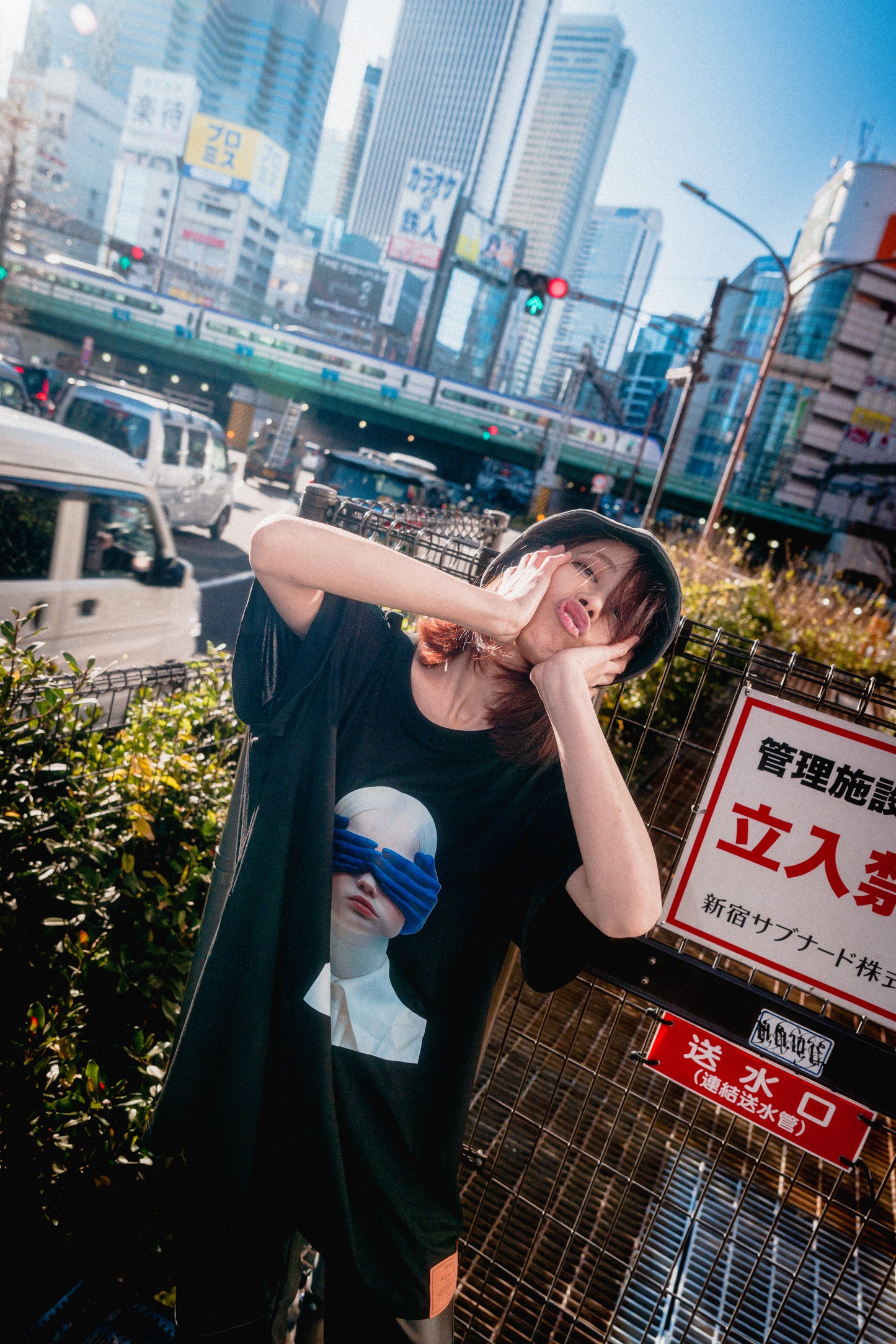 Person in a cityscape with a large building in the background